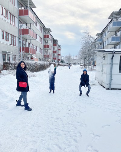 Nirmal's family playing with snow in winter